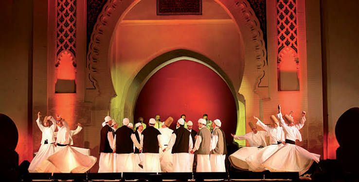 Evening concert at the Festival of World Sacred Music, Fes, with the illuminated Bab Makina palace courtyard